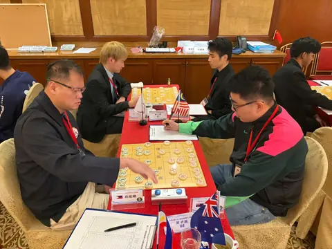 Männer, Runde 6, Brett 8: Chong Heung Ming (Philippinen) gegen Yu Wenbin (Australien).